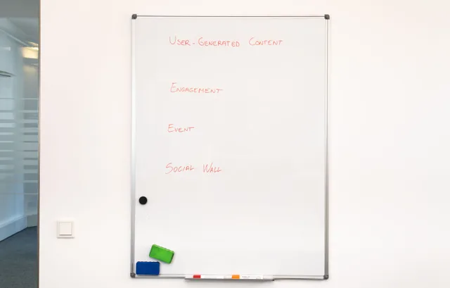 Office whiteboard displaying text related to user-generated content strategy. B2B content marketing best practices: reader briefs, method notes, and claim registers